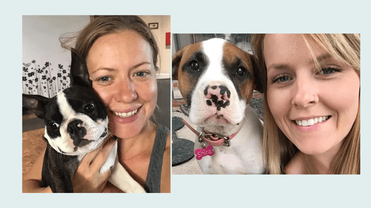 Two girls holding their dogs.